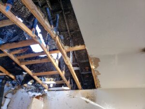 Looking up into the roof of a fire damaged home.